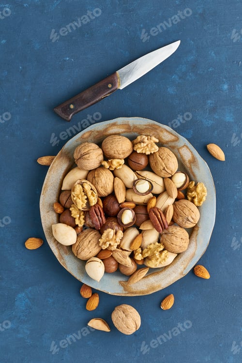 Preview: Mix of nuts on plate - walnut,