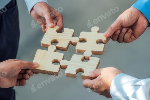 Preview: Teamwork and partnership concept.Business people work together and putting puzzle pieces, jigsaw.