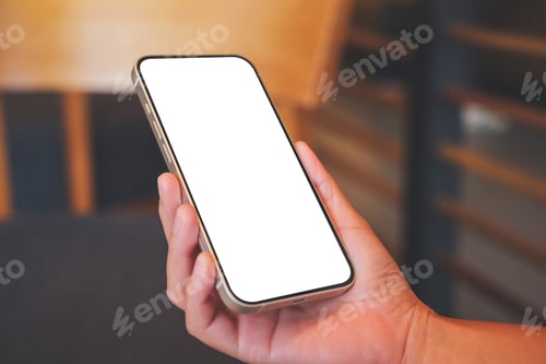 Preview: Mockup image of a woman holding mobile phone with blank desktop screen in cafe