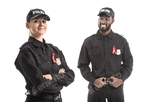 Preview: smiling police officers with aids awareness red ribbons isolated on white