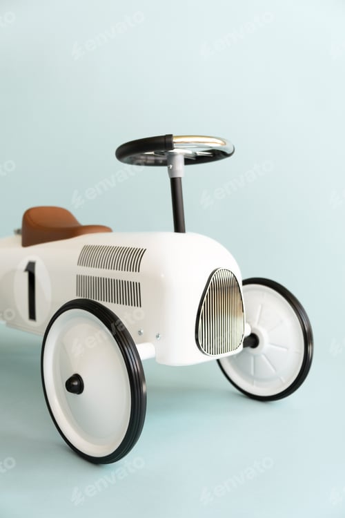 Preview: Kid's playing room interior. Retro style beige toy car on blue background.