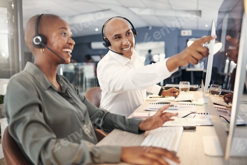 Preview: Mixed race male call centre telemarketing agent discussing plans with colleague while working toget