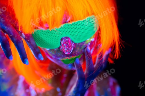 Preview: Fashion model woman in neon light, portrait of beautiful model girl with fluorescent make-up.