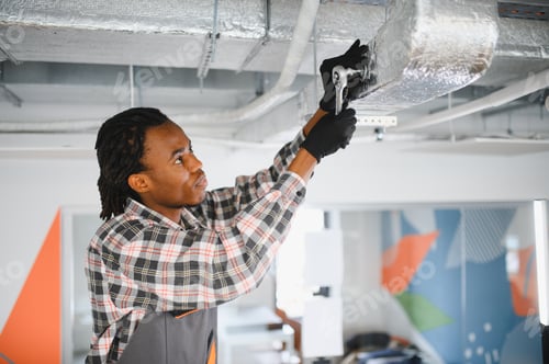Preview: Technician repairing ventilation system with ratchet wrench