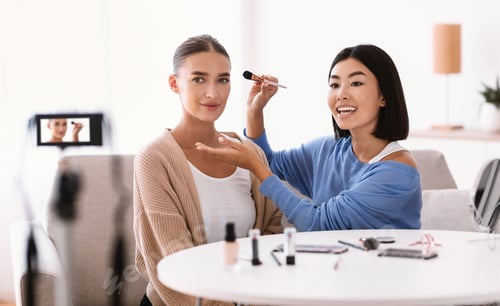 Preview: Asian Woman Doing Makeup For Her Model
