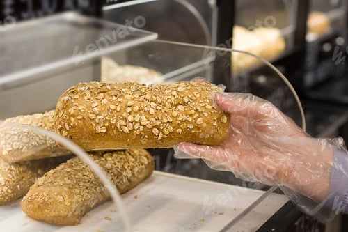 Preview: Female Hand Choosing Olive Oil In The Market