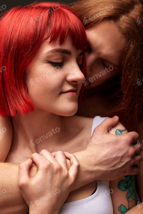Preview: Close-up studio portrait of a passionate young couple in love embracing. A handsome muscular semi
