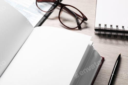 Preview: Law. Book, glasses, form and stationery on wooden table, closeup