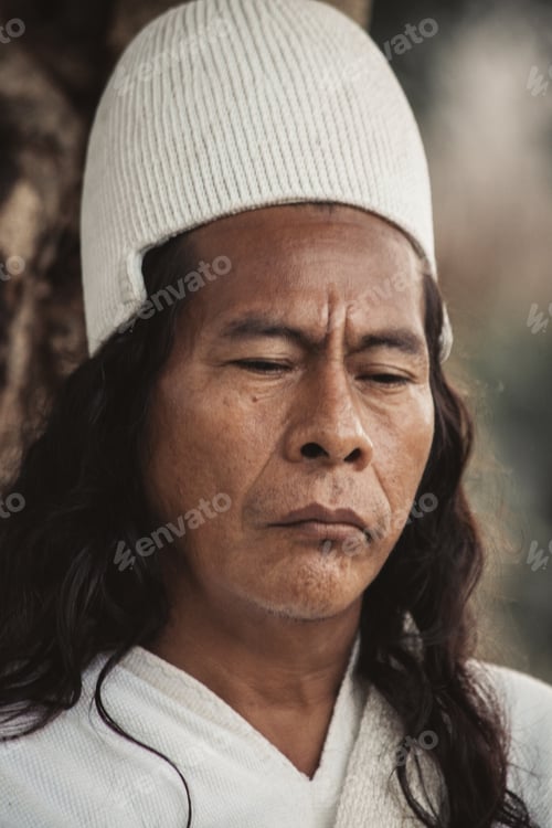 Preview: Portrait of an Arhuaco Indian dressed in traditional dress with a pensive attitude.