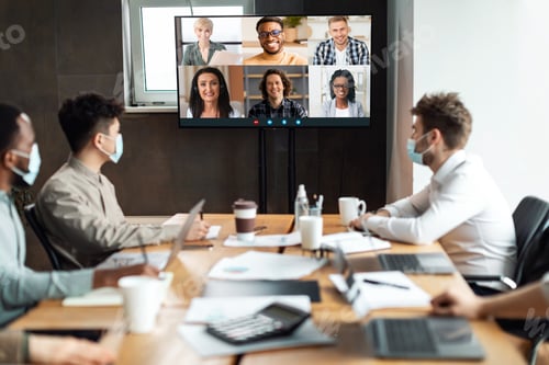 Preview: Diverse businesspeople making online videocall to employees