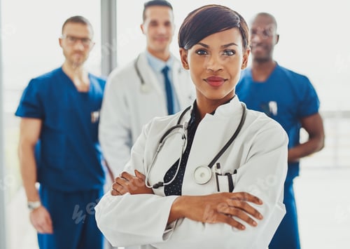 Preview: Black female doctor in front of team