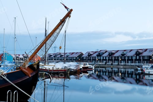 Preview: ship and yacht at marina before sunrise