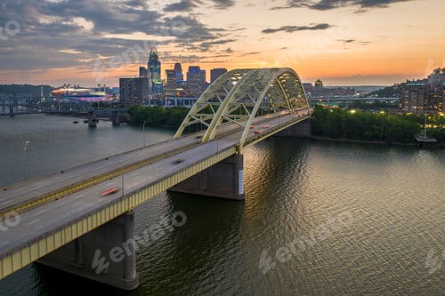 Preview: Downtown district of Cincinnati city in Ohio, USA at night with driving cars traffic