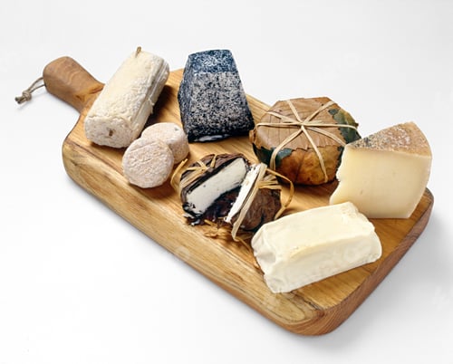 Preview: Assortment of cheeses displayed on a cheese board