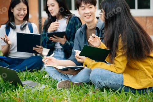 Preview: Young Asian People college students and a female student group work at the campus park in morning