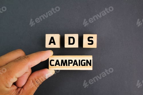 Preview: wooden block with the word ADS campaign.