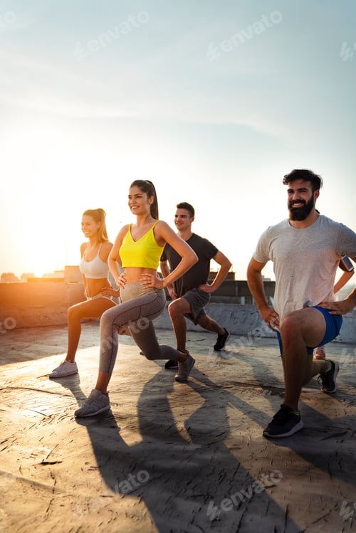 Preview: Portrait of smiling fit happy people doing power fitness exercise