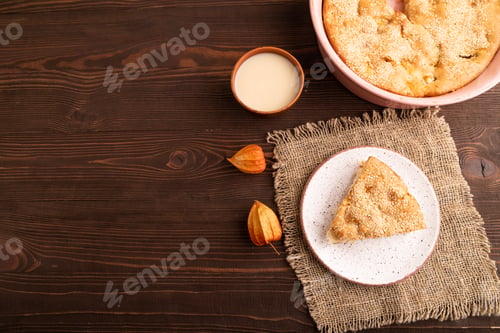 Preview: Apple Charlotte cake on brown wooden, top view, flat lay, copy space