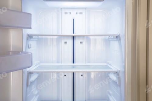 Preview: Modern white open refrigerator close-up with empty shelves, front view.