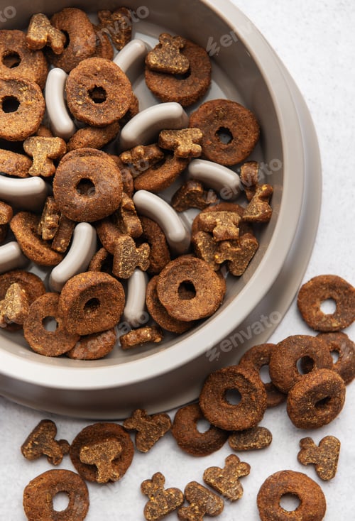 Preview: Dry dog food in bowl and scattered on table, promoting healthy eating habits