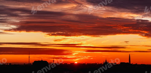Preview: Large aerial panorama of silhouette cityscape at amazing city orange sunset