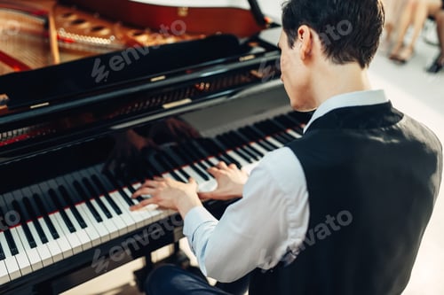 Preview: Pianist playing music on grand piano