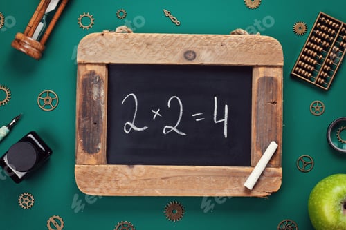Preview: Retro school accessories with math problem on old chalkboard. Back to school concept