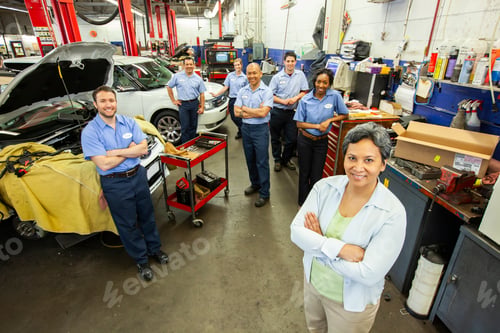 Preview: Portrait of a team of Mechanics in Auto Repair Shop viewed from above