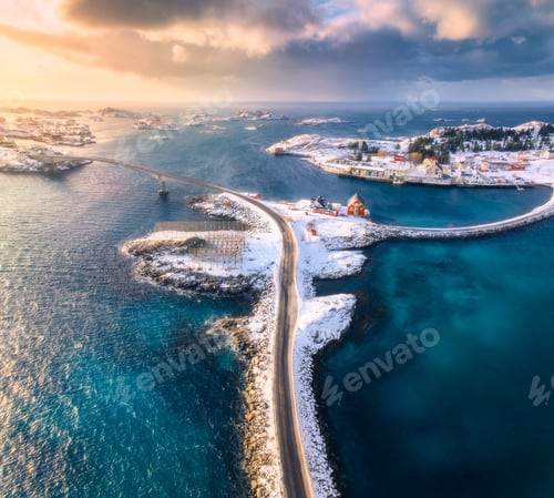 Preview: Aerial view of road, bridges, snowy islands, rorbu, sea at sunset