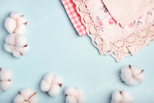Preview: Cotton bolls and napkins made of cotton fabric on a blue background
