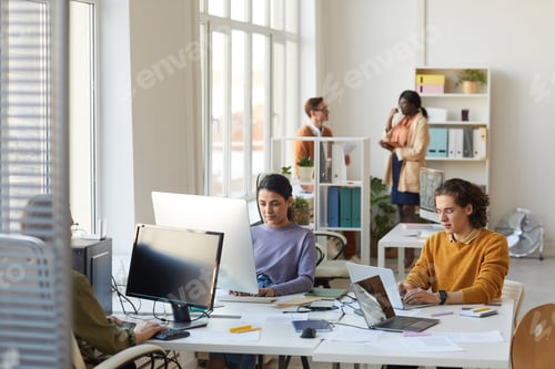 Preview: Creative Young People Using Computers in Office