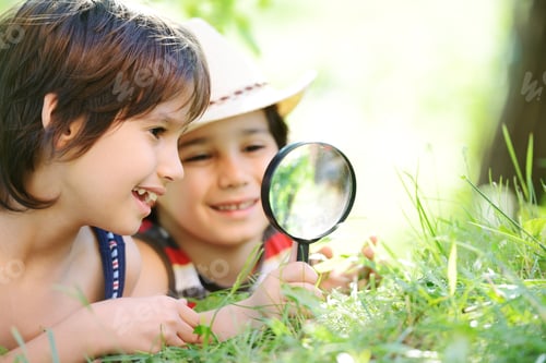 Preview: Happy Kid Exploring Nature With Magnifying Glass