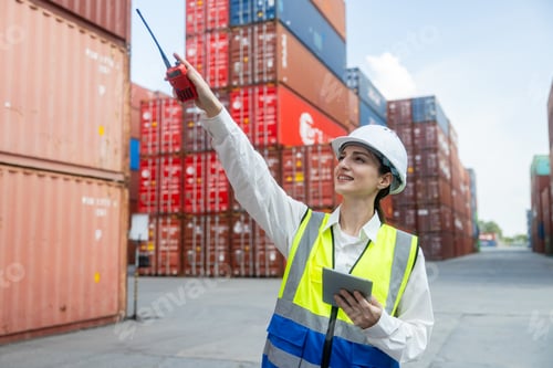 Preview: Engineer port manager communicating in container yard