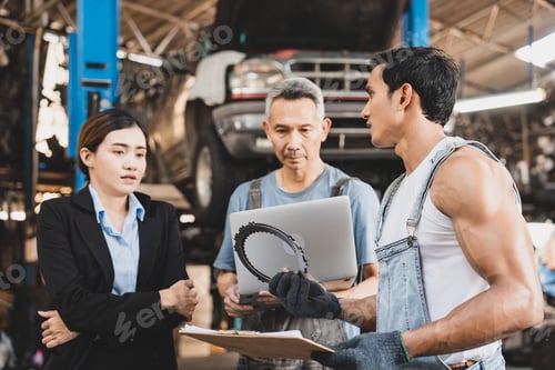 Preview: professional male technician mechanic man working to repair maintenance automobile at garage service