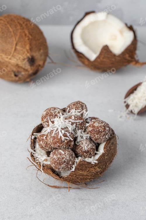 Preview: Homemade vegan healthy candies with sugar-free coconut chips, made from dried fruits and nuts