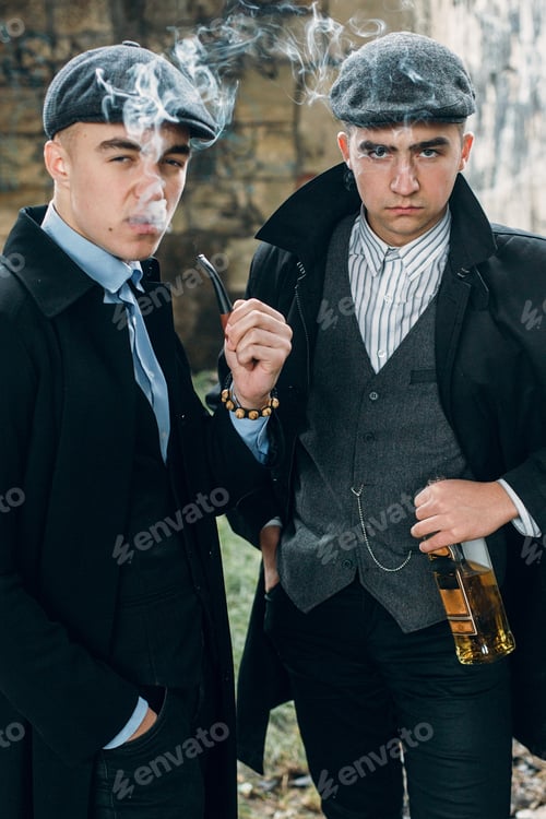 Preview: Posing on background of railway with bottle of alcohol