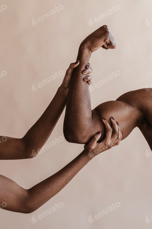 Preview: Woman touching a muscular arm