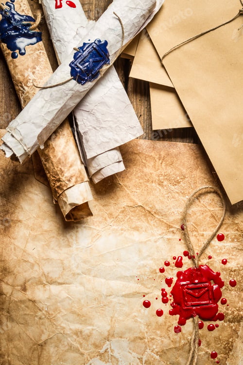 Preview: Closeup of old scrolls and sealing wax on wooden table