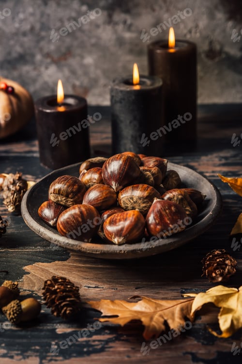 Preview: Organic sweet chestnuts with pumpkins on kitchen table, prepared for baking or cooking