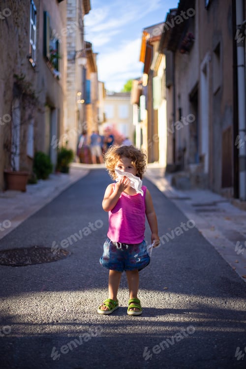 Preview: Smiling child standing on street