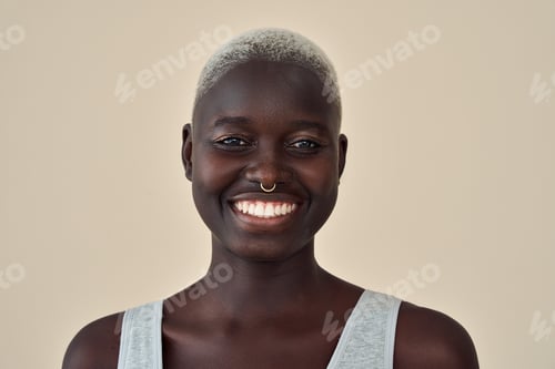 Preview: Young happy African Black woman beauty model at beige background. Portrait.