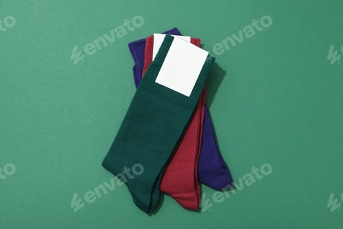 Preview: Multicolored high socks on a green background.