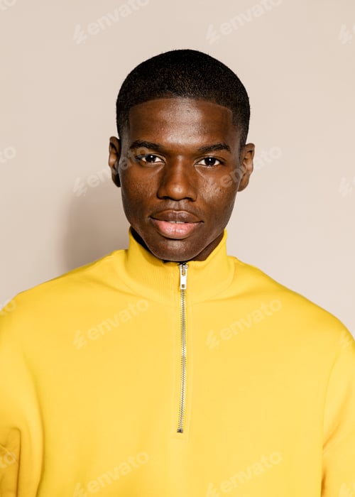 Preview: Black man in yellow zip up sweater portrait