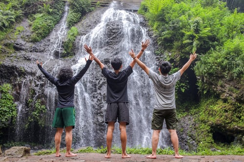 Preview: Three Friends Celebrating Life At Stunning Waterfall Adventure In Lush Greenery