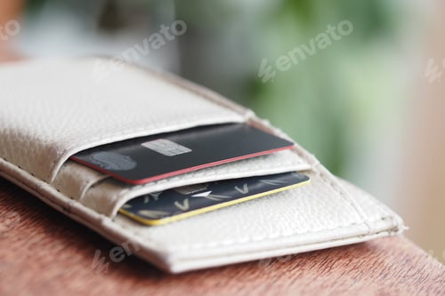 Preview: Wallet with credit cards displayed on a wooden surface
