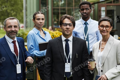 Preview: Diverse Group of Business Professionals Posing Outdoors during Conference