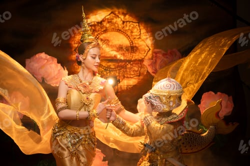 Preview: Traditional Thai dance performance featuring a graceful female dancer and a masked Khon performer