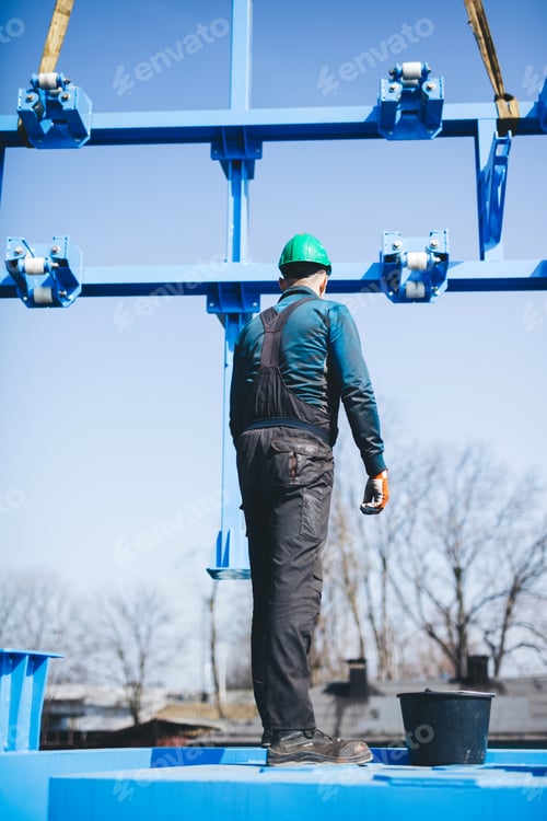 Preview: Manual worker working at shipyard construction site