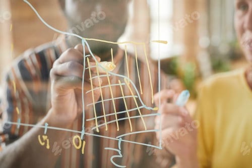 Preview: People examining graphics together