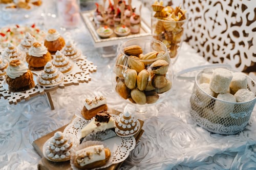 Preview: Table with muffins, cakes, sweets, candy, buffet. Dessert table for a party goodies for the weddi
